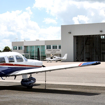 Tampa Executive Airport hangar and plane